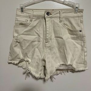 These r high waisted ripped jean shorts with a tan stitching and no stains/rips